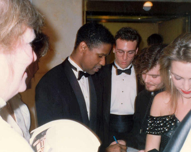 A Younger Denzel Washington Signing Autographs