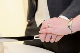 couple cutting cake on wedding day